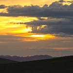 Golden sunset silhouette over mountain Mongolia