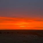Fiery orange-red sunset over the Gobi Desert Mongolia