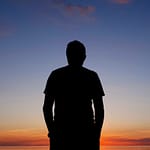 Man silhouetted at Khuvsgul Lake sunset northern Mongolia — Khuvsgul Lake Explorer Tour