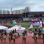 Naadam Festival opening ceremony horsemen galloping at National Stadium Ulaanbaatar Mongolia